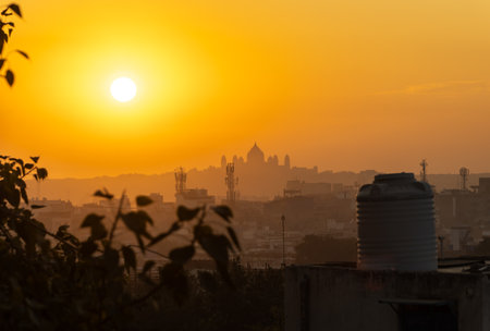 sunrise orange sky over city fort shadow at dawn from flat angle image is taken jodhpur rajasthan india.の写真素材