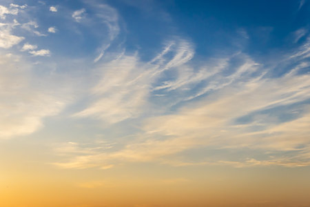 dramatic sunrise orange sky with white cloud at morning at outdoorの写真素材