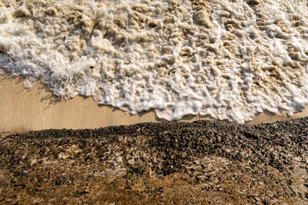 Crashing Sea Waves at Shore at morning from top angleの写真素材