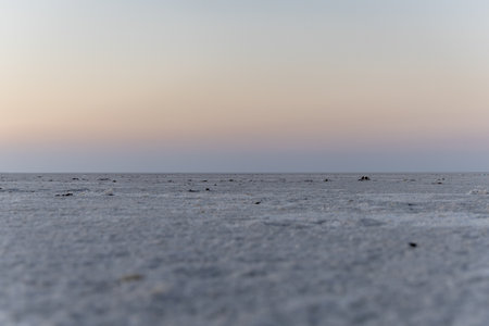 white salt flats desert with dramatic orange sunset sky at dusk image is taken at dhordo kutch white rann gujrat india.の写真素材