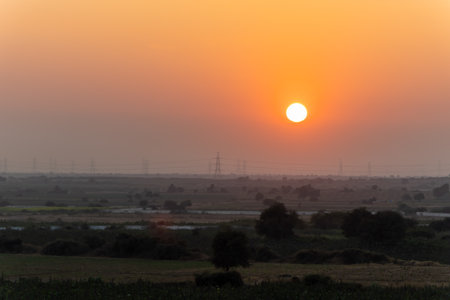 sunset view with orange sky at duskの写真素材