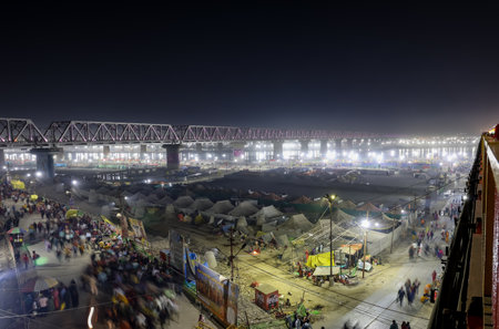 temporary camps with blurred crowd moving to triveni sangam at mahakumbh festival image is taken at mahakumbh mela prayagraj uttar pradesh india.の写真素材