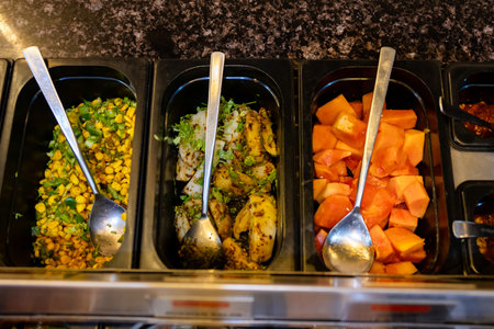 assorted fresh salads displayed for unlimited buffet dining indoorsの写真素材