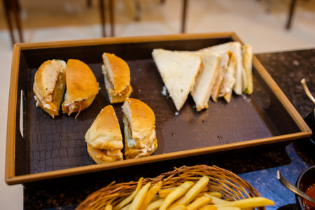 freshly prepared burger and sandwich ready to serve at indoorsの写真素材