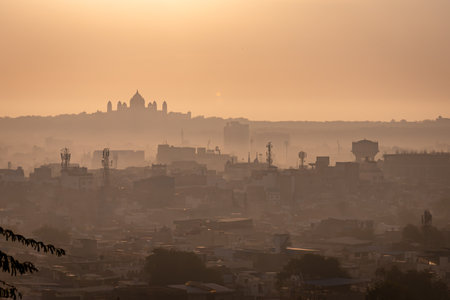 Crowded Cityscape with Palace and Sunrise Mistの写真素材