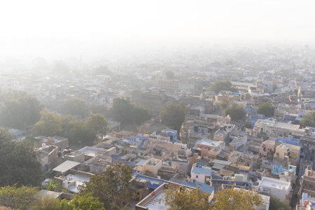crowded misty city view from mountain top at morning image is taken at jodhpur rajasthan india.の写真素材