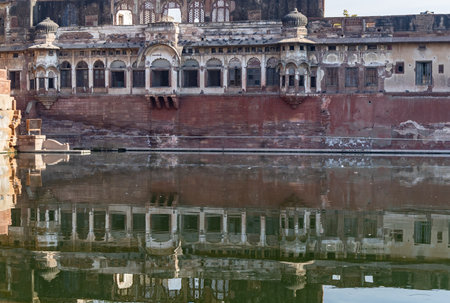 pristine calm lake with water reflection of vintage architecture around at morning image is taken at Gulab sagar talab jodhpur rajasthan india.の写真素材
