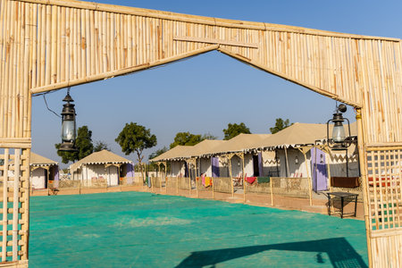 desert camp setup entrance view in natural surroundings with bright skyの写真素材