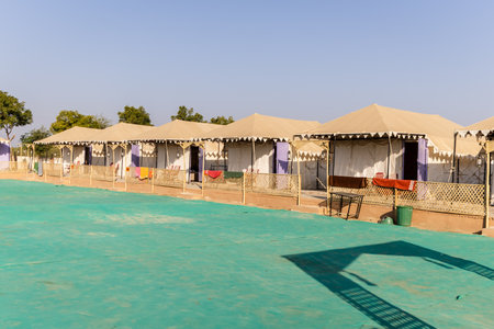 desert camp setup in natural surroundings with bright skyの写真素材