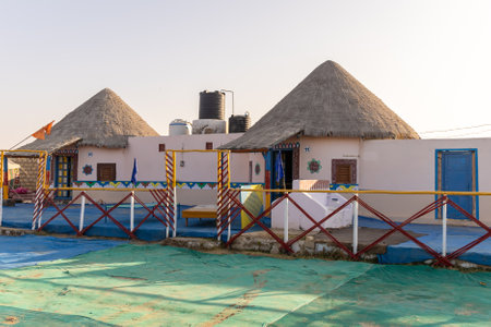 traditional desert camp bamboo hut in natural surroundings with bright skyの写真素材