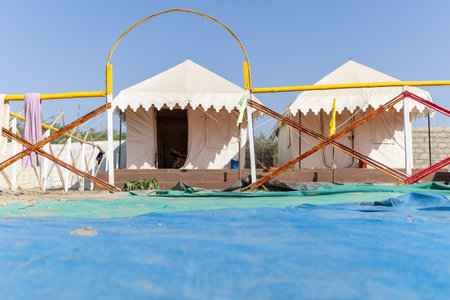 desert camp setup in natural surroundings with bright skyの写真素材