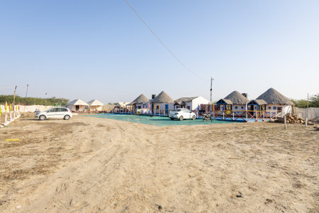 traditional desert camp bamboo hut in natural surroundings with bright skyの写真素材