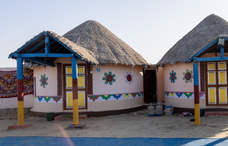 traditional desert camp bamboo hut in natural surroundings with bright skyの写真素材