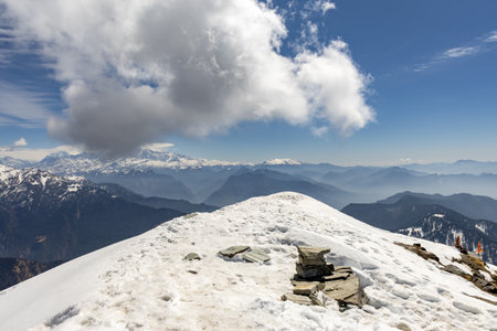 stunning snow-covered mountain summit with layered peaks under clear sky image is taken at chandrashila trek summit tungnath chopta uttarakhand india.の写真素材
