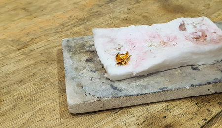 gold kept at white sheet for melting and quality check during jewelry makingの写真素材