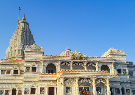 ancient white marble hindu temple unique architecture at dusk from flat angle image is taken at prem mandir uttar pradesh india.の写真素材