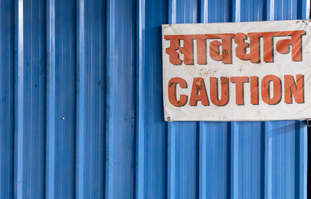 caution signboard at construction site at eveningの写真素材