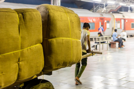 Luggage Transfer Trolley with Heavy Loads at Railway Platform in the Evening image is taken at jodhpur railway station rajasthan india on Oct 27 2023.の写真素材