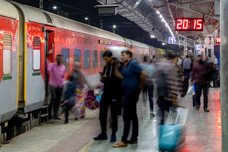train standing at platform with blurred passenger walking at railway station image is taken at jodhpur railway station rajasthan india.の写真素材