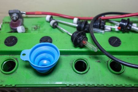home inverter battery being refilled with water at indoor
