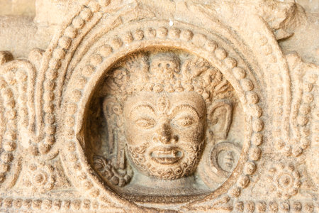 artistic stone carving on antique sculpture indoorの写真素材