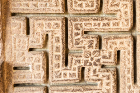 ancient artistic stone sculpture at indoor heritage siteの写真素材