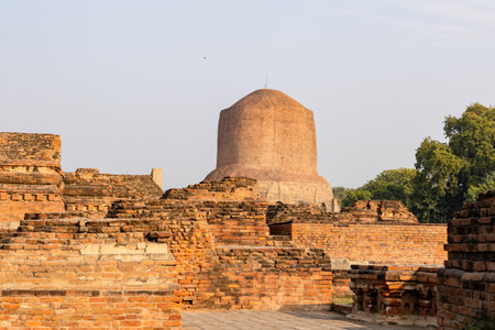 ancient buddhist dhamek stupa at sarnath with clear blue sky at Sarnath near Varanasi, India, marking the sacred site where Buddha gave his first sermon.の写真素材