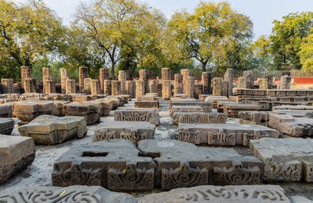 sarnath archaeological site with excavated ancient stone ruins at in daylight at Sarnath near Varanasi, India, marking the sacred site where Buddha gave his first sermon.の写真素材