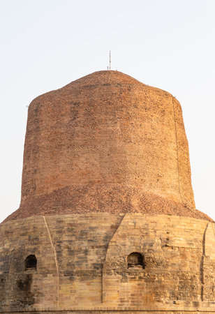 close up view of ancient dhamek stupa ruins at sarnath near varanasi india in sunlight at Sarnath near Varanasi, India, marking the sacred site where Buddha gave his first sermon.の写真素材