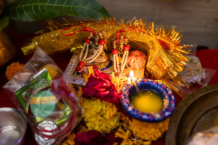 sacred idols of ganesha and lakshmi decorated with offerings for diwali at temple