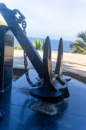 large iron ship anchor rests on the ground during the day image is taken at the ross island port blair, Andaman Nicobar Islands, India.の写真素材