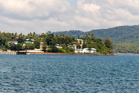 scenic ocean view with distant forested island and calm waters