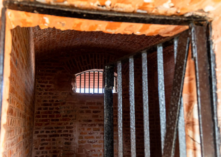 historic architecture of a prison with barred windows image is taken at the Cellular (Kala Pani) Jail, Andaman Nicobar Islands, India.の写真素材
