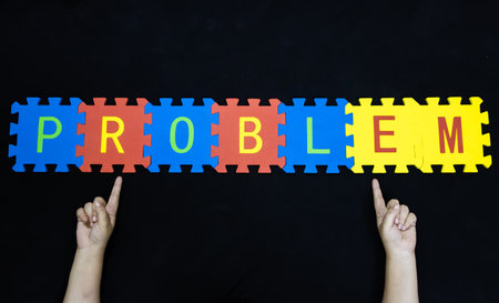 business challenge concept hands pointing to word problem with tilesの写真素材