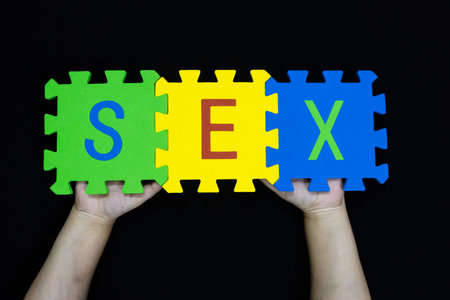 word sex on colorful puzzle pieces showing sexual education conceptの写真素材