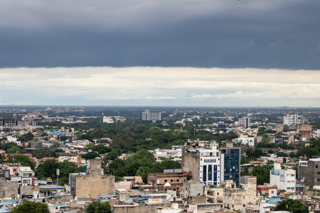 populated indian city with dramatic sky overcast during monsoon season at afternoonの写真素材