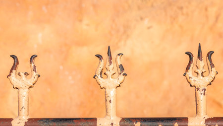 detailed view of holy trident associated with hindu deity shiva in sunlightの写真素材