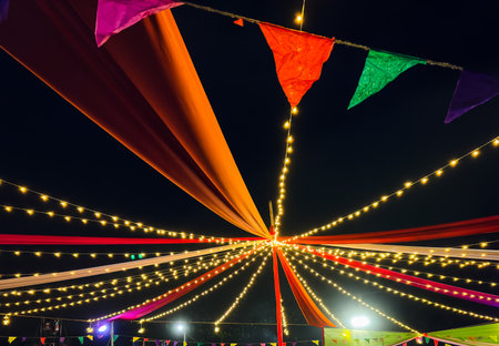 vibrant decorative drapes and fairy lights for festive celebrationの写真素材