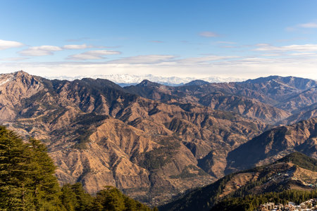 scenic high-altitude hills with winding valleys and distant peaksの写真素材