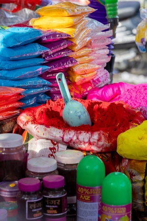 multicolored festival powder packets arranged for holi celebration saleの写真素材