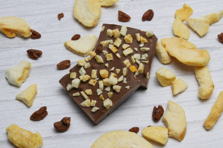 Square bars of hand made chocolate with freeze dried peach and pecan