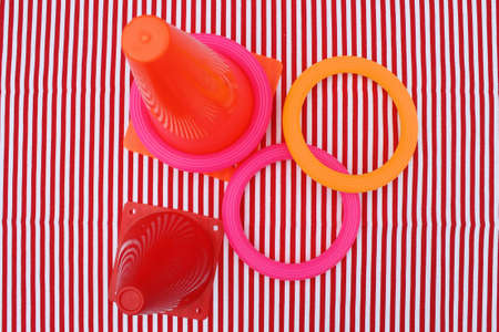 Toss the rings game on red and white striped table clothの写真素材