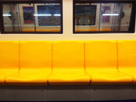 yellow chair on BTS skytrain.の素材