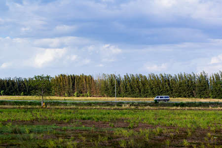 A van traveling on country roadの写真素材