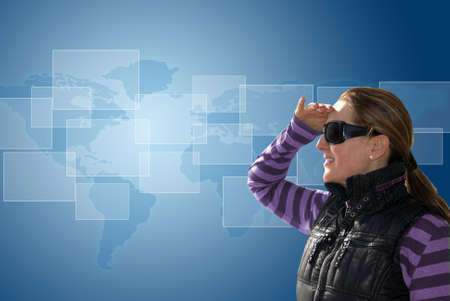 Woman looking to the horizon to see the modern world and technologicalの写真素材