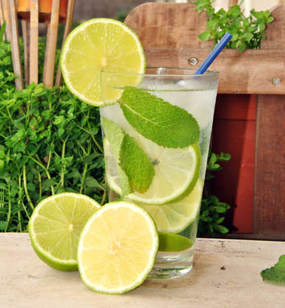 Cocktail Mojito made with run, mint and lime in summer terreaceの写真素材
