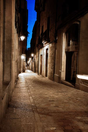 street in the center of Girona at nightの写真素材