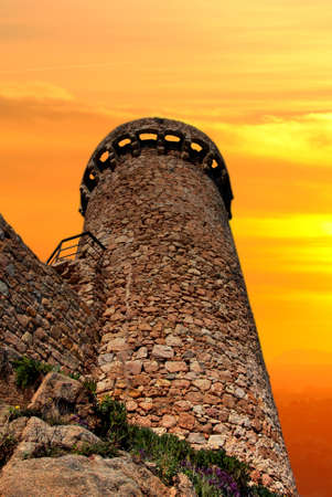 tower of a castle in full sunset in autumnの写真素材