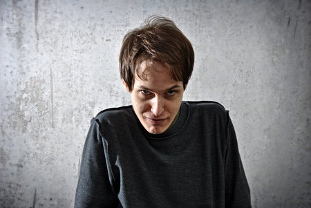 young man with a look of evil and diabolical faceの写真素材