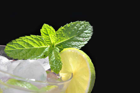 glass of mojito cocktail with mint, lime and sugarの写真素材